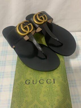 Gucci Black Sandals with Gold Logo Accent